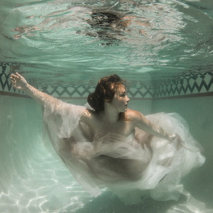 Post wedding shoot in a small, private pool. by Helen Brierley 